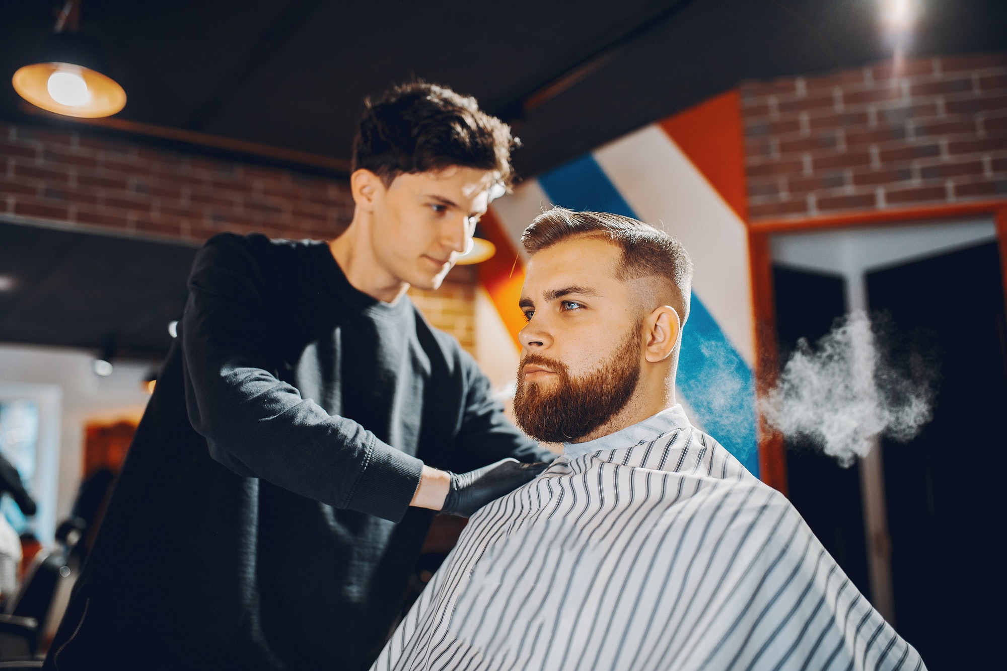 stylish man sitting in a barbershop