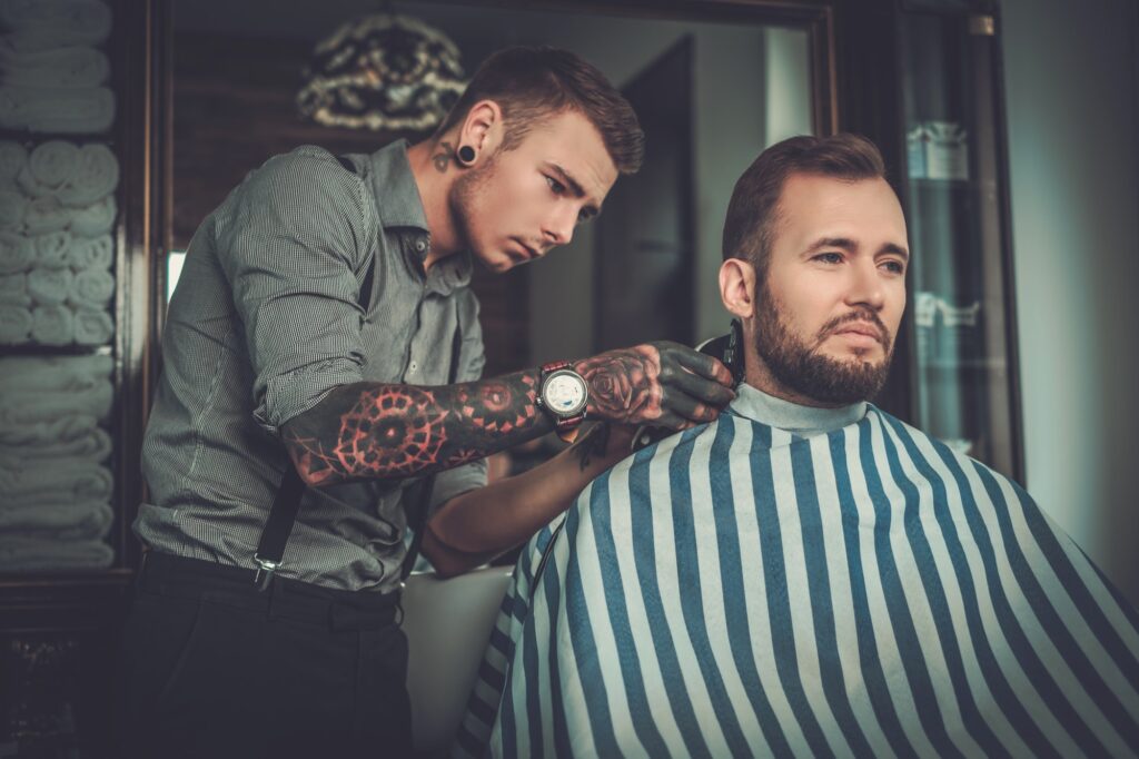 confident man visiting hairstylist in barber shop 1 1
