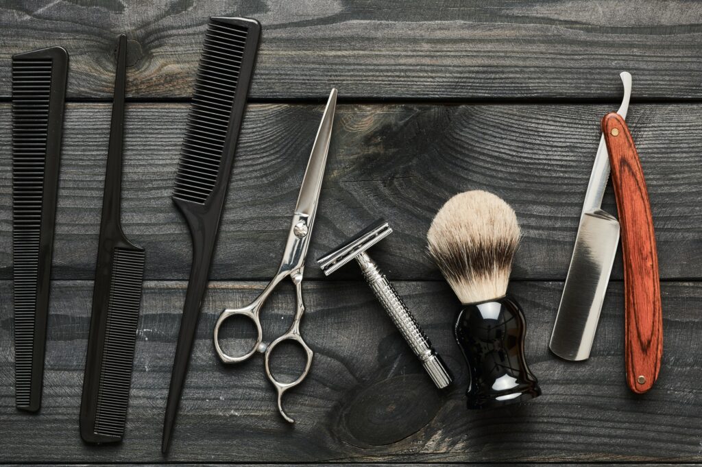 vintage barber shop tools on wooden background